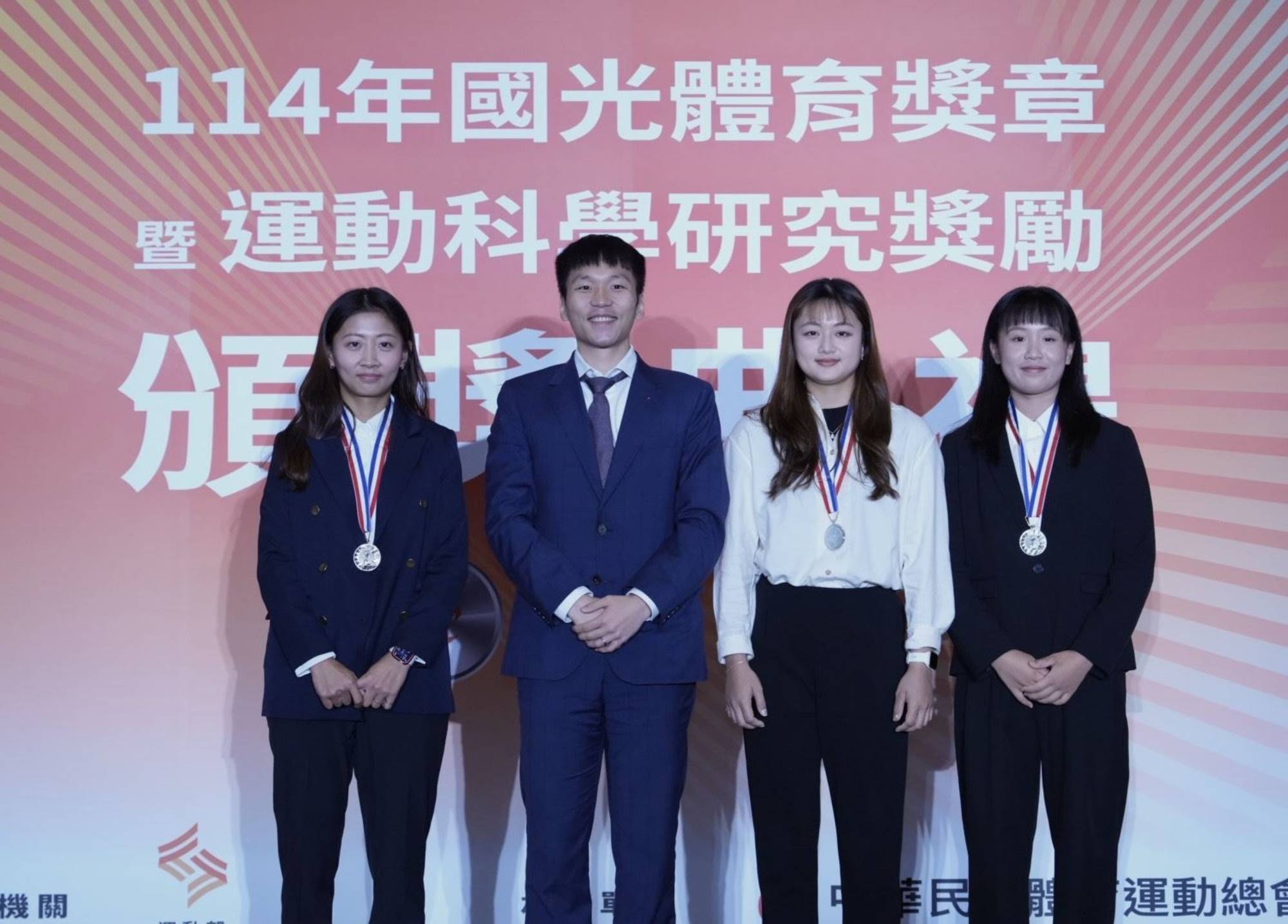 Minister Lee Yang pictured with members of the women's recurve bow archery team